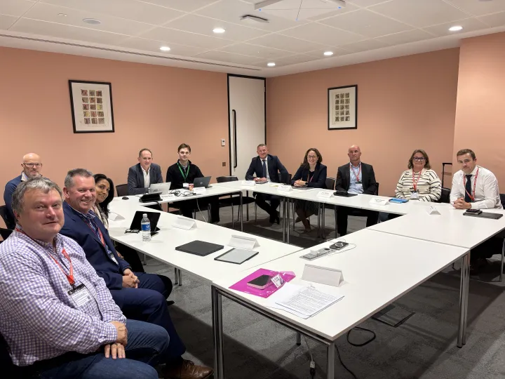 A group of Government officials and stakeholders around a table with the BVRLA and members