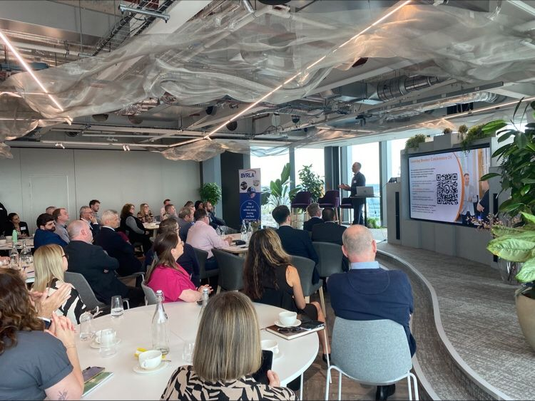 BVRLA Compliance Forum April 2024 - comprising of audience members, presenters and large screen