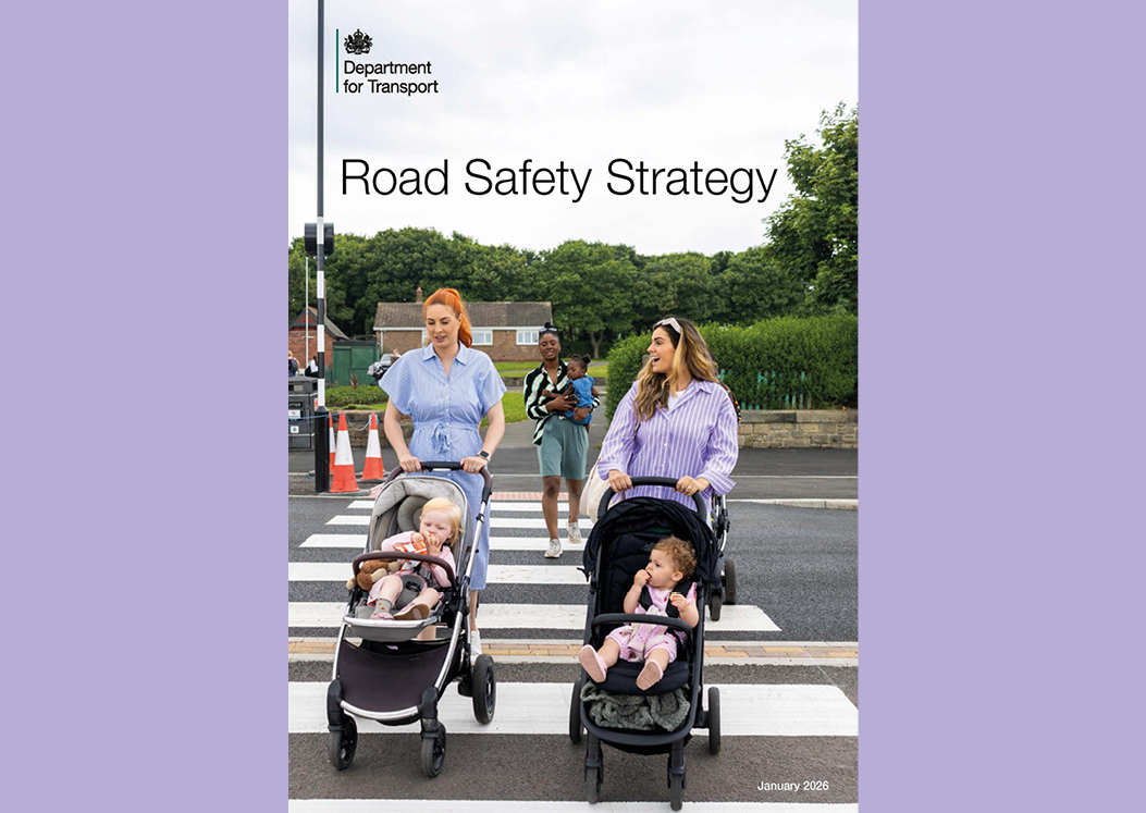 Front cover of Government's Road Safety Strategy, young mums are crossing zebra crossing with small children