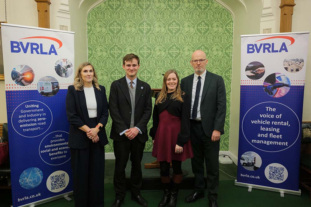 Group shot with two BVRLA banners either side, left to right - Sarah Gray, Keir Mather MP, Sarah Edwards MP, Toby Poston