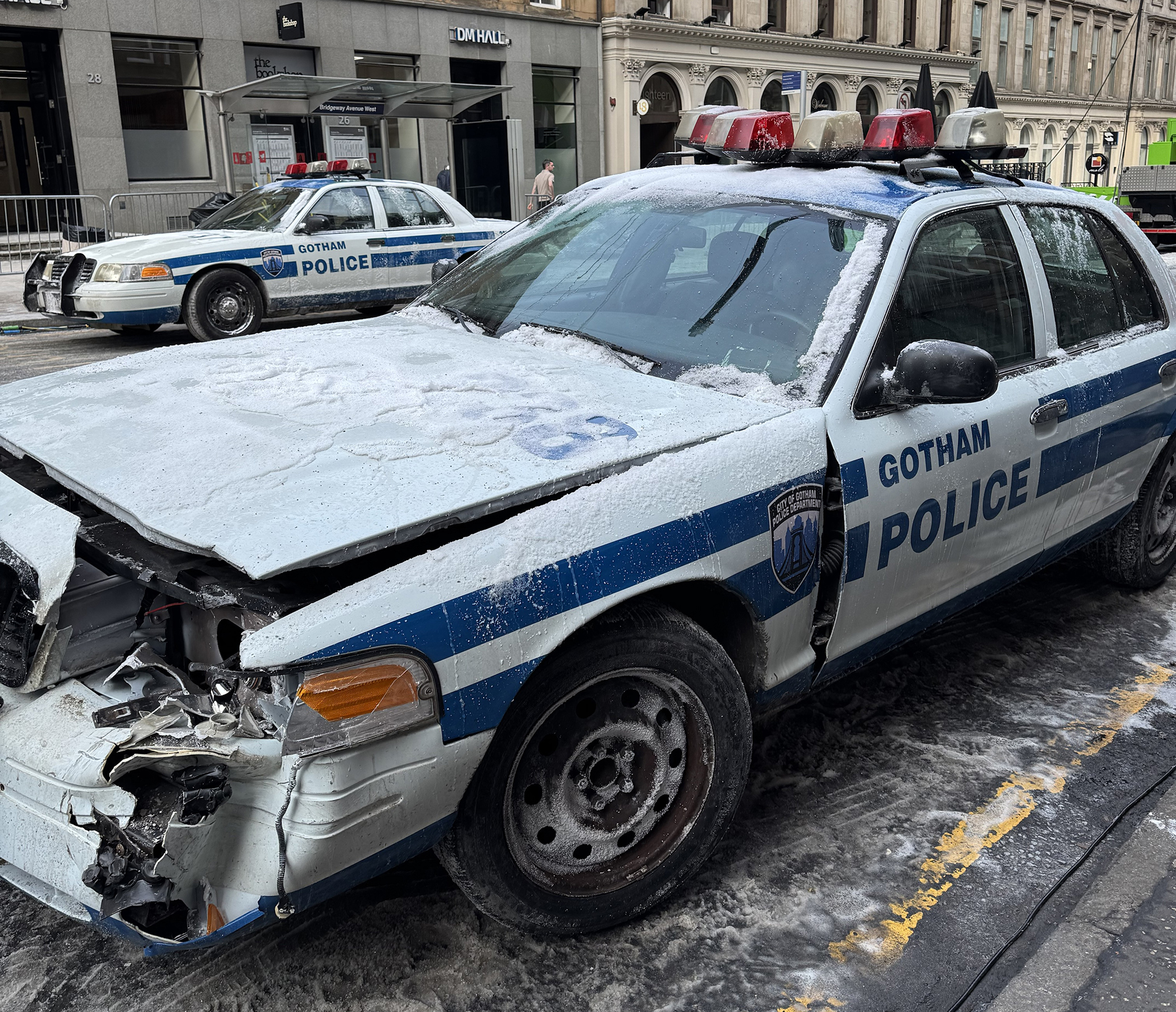 On a movie set for The Batman Part II in Glasgow, a beaten up Gotham police car