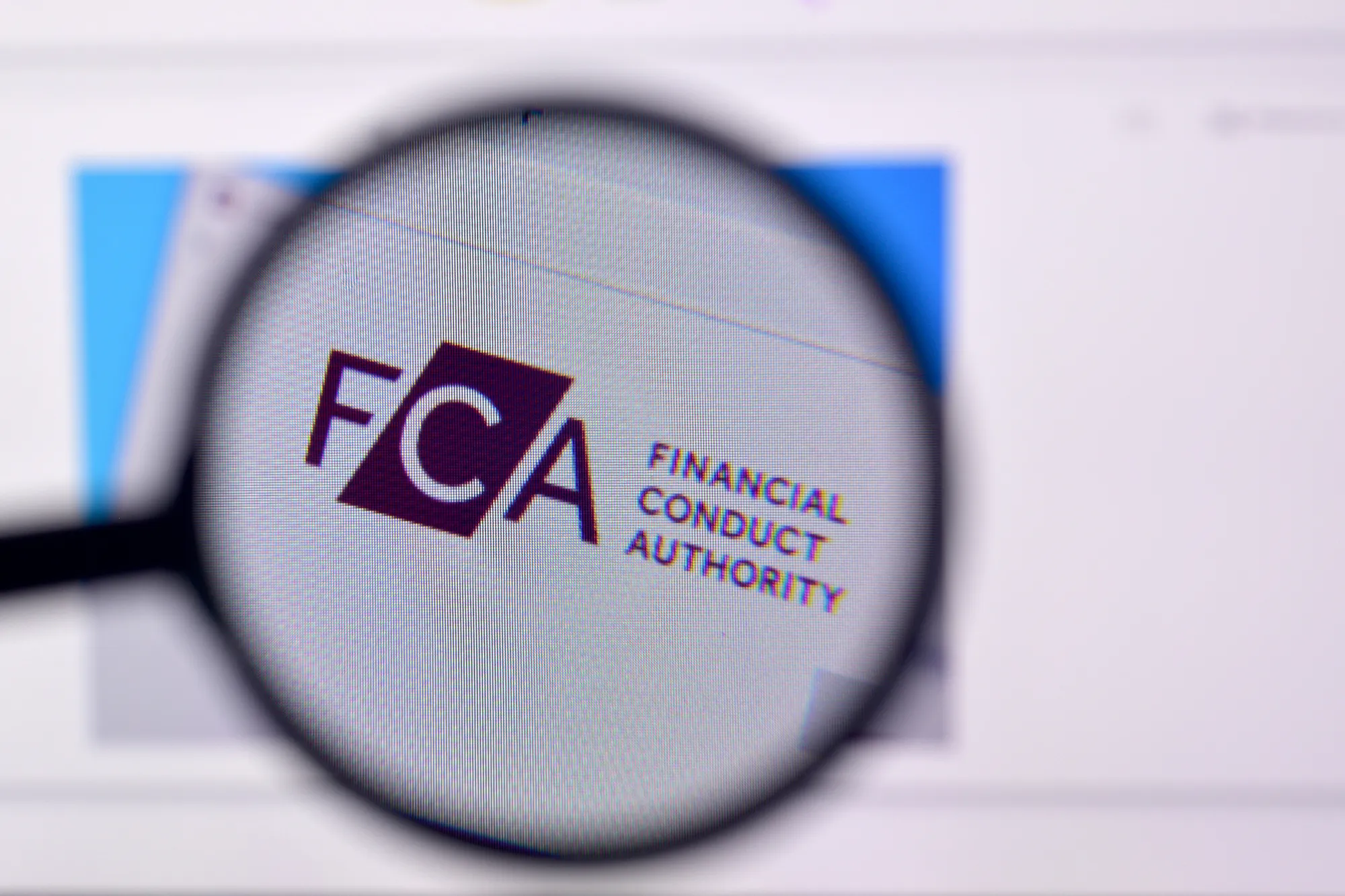 Image of the Financial Conduct Authority FCA logo with a magnifying glass framing it