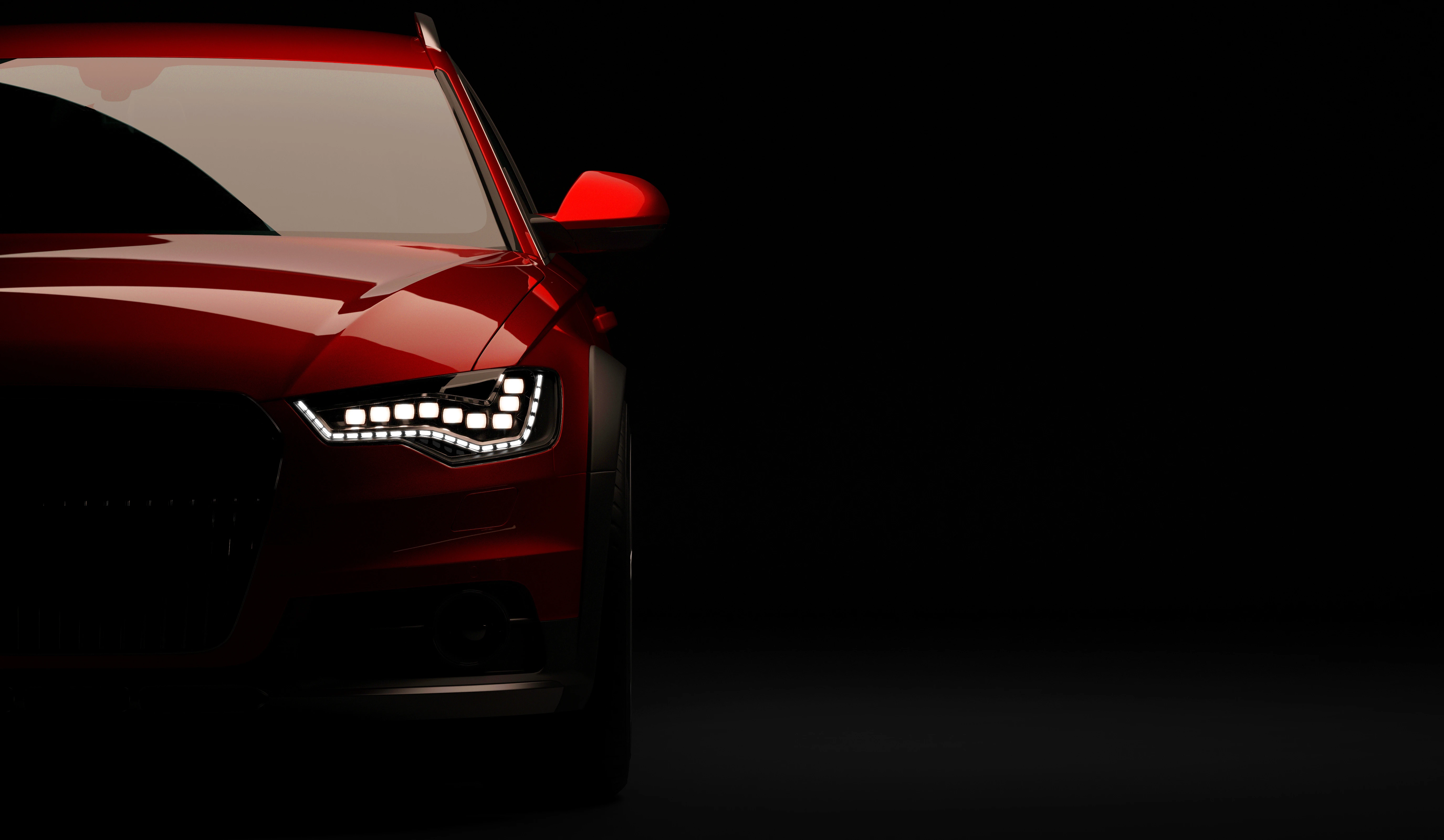 Stylish car on a black background with led lights on. Futuristic modern vehicle head light xenon on dark