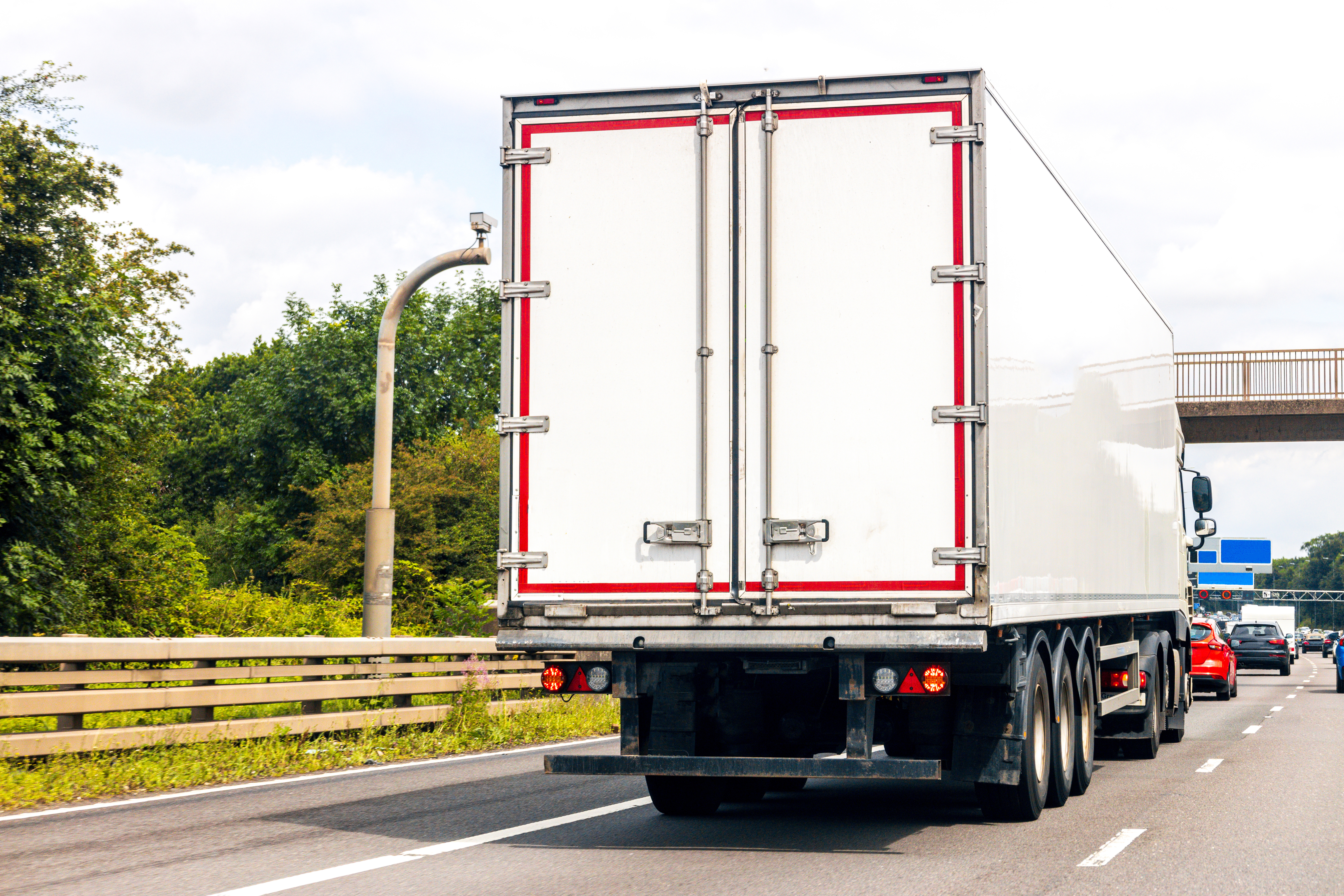 UK motorway with HGV prominent and vehicles ahead of it