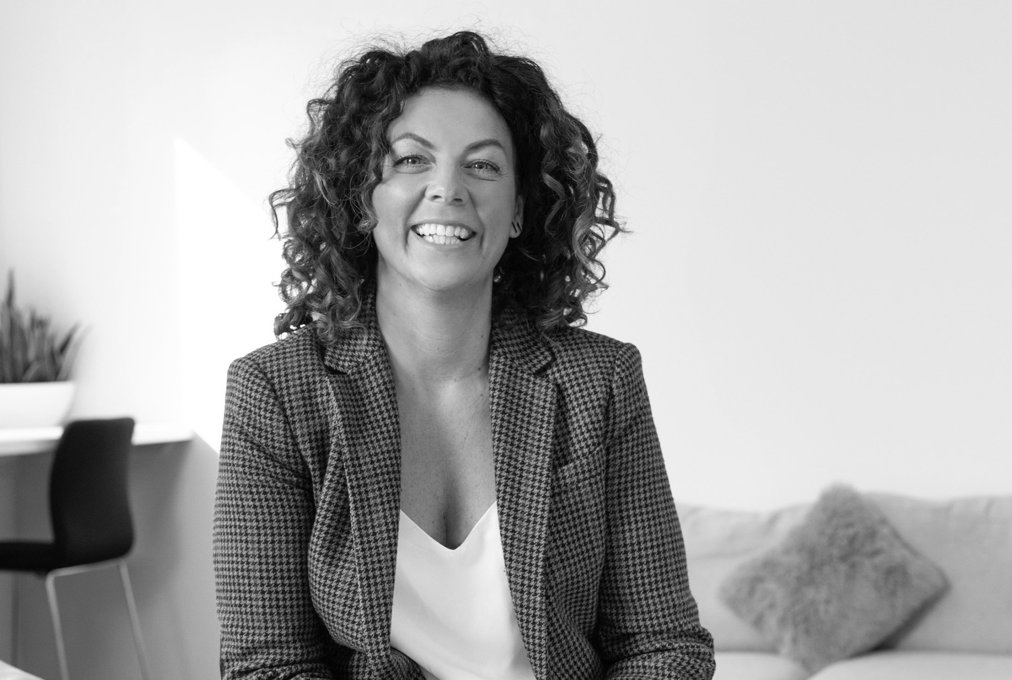 Jodie Monaghan, Operations Director at Tusker in black and white