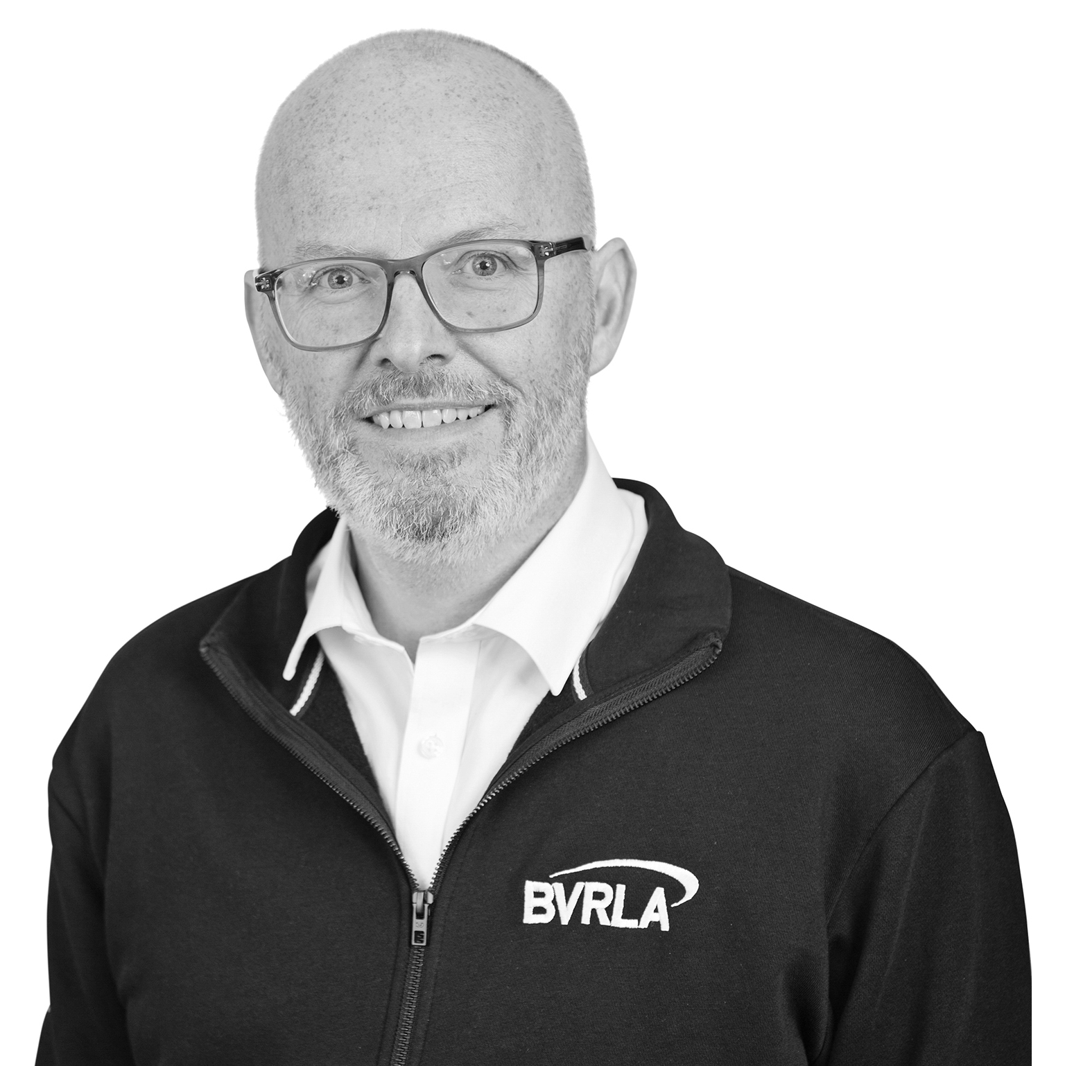 Black and white image of BVRLA Chief Executive Toby Poston with a BVRLA logo on his jacket